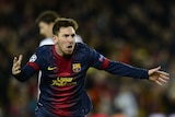 Lionel Messi celebrates scoring a goal for Barcelona in the Champions League against AC Milan.