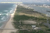 Aerial image of an undeveloped Spit on Gold Coast with high-rise buildings in the background.