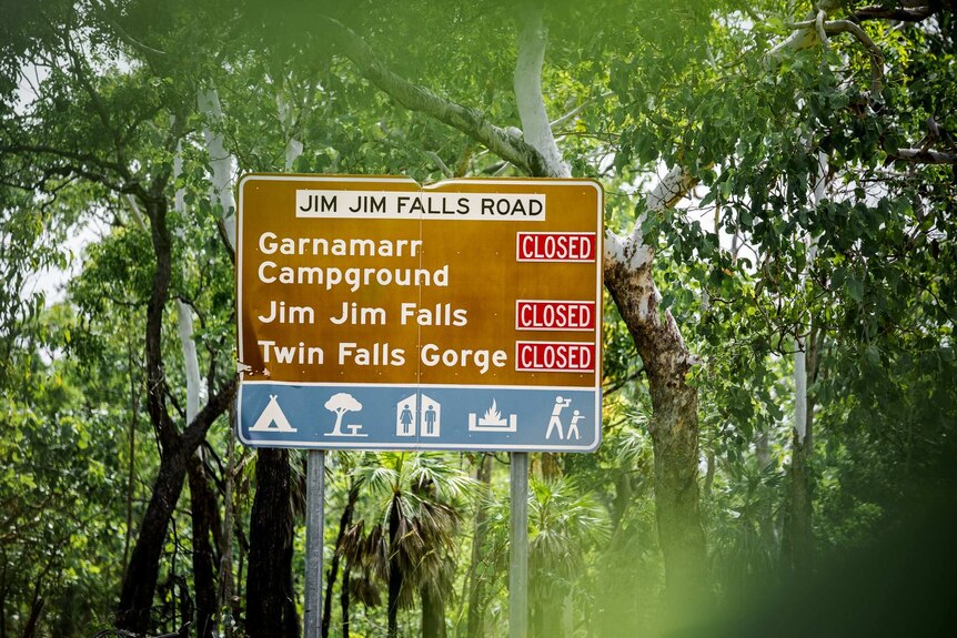 A road sign in Kakadu indicates road closures at Garnamarr Campground, Jim Jim Falls and Twin Falls Gorge.