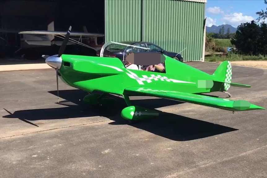 The ultralight plane on the tarmac at an airport at Murwillumbah, date unknown.