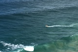 Surf Life Saving Queensland and emergency services search for a man missing in rough sea