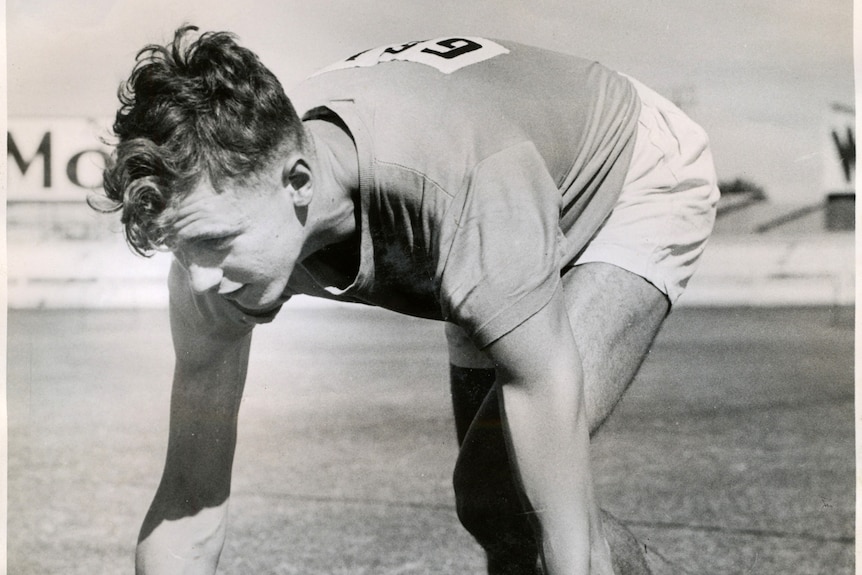 Black and white photo of Leon Gregory preparing to race.