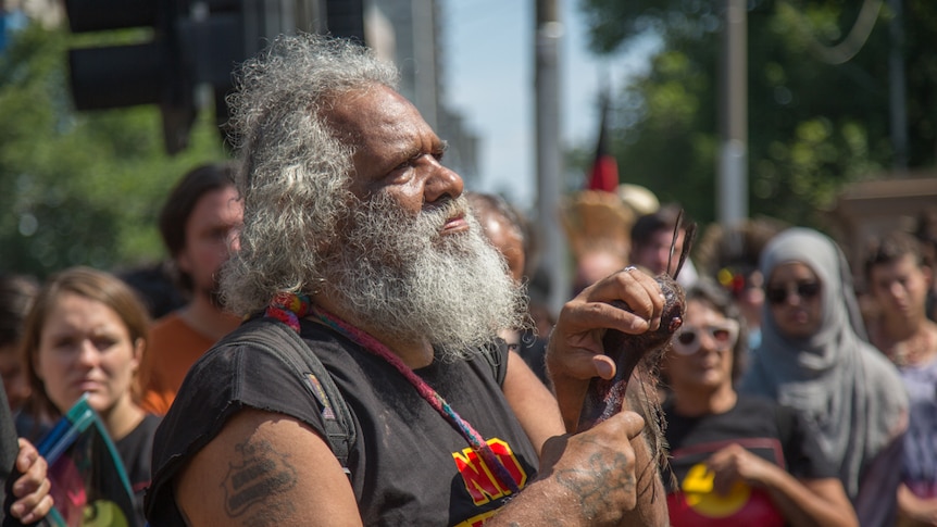 An indigenous elder joined the thousands of protesters in Melbourne.