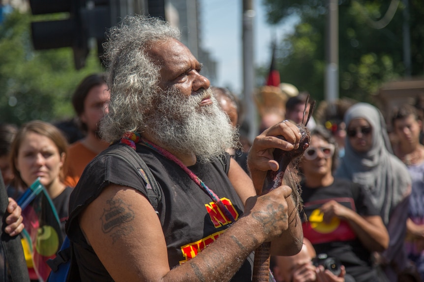 An indigenous elder joined the thousands of protesters in Melbourne.