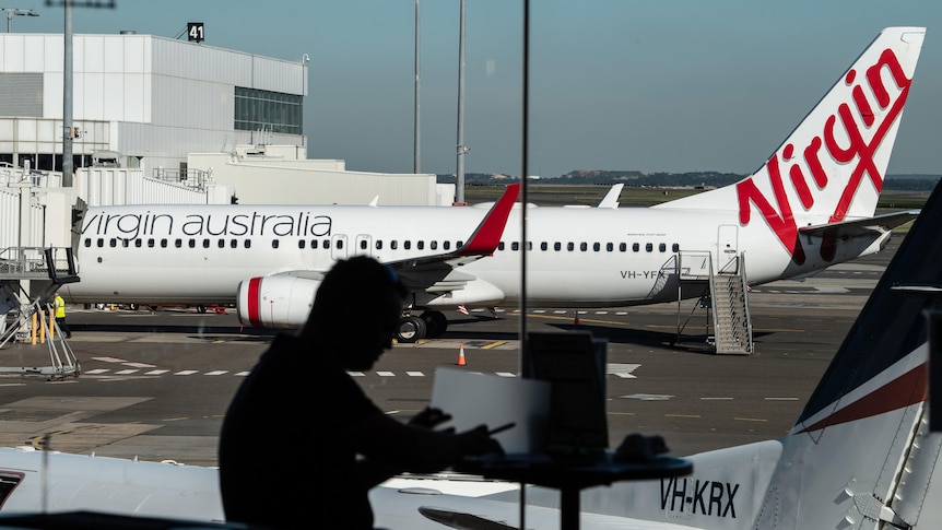 a virgin airlines plane on the tarmac at sydney airport