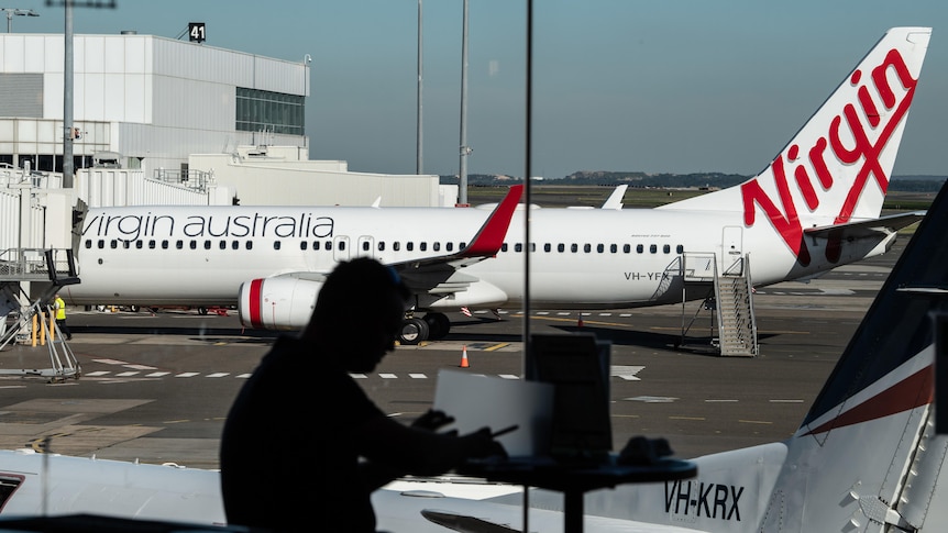 A virgin airlines plane on the tarmac at sydney airport