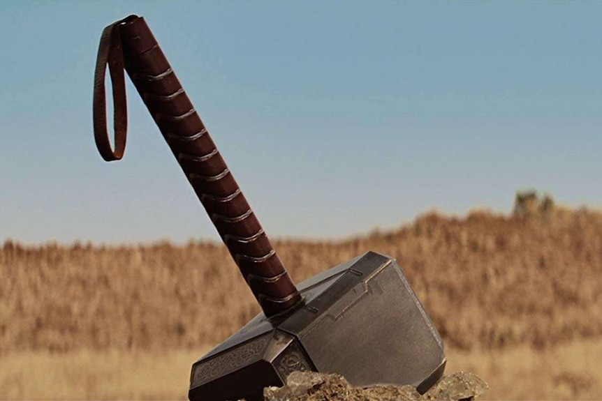 Thor's hammer Mjolnir in the ground.