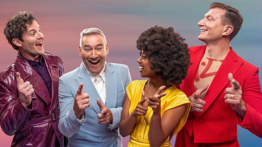 4 people dressed in bright colours looking at each other