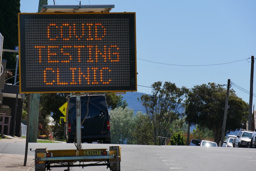 A COVID-19 testing clinic sign.