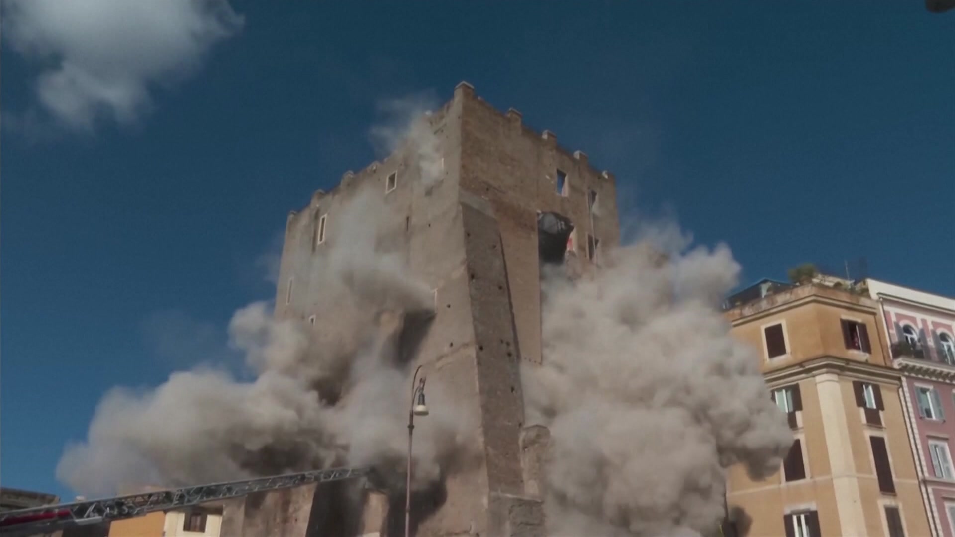 Dust clouds are discharged through windows and doors of a medieval tower