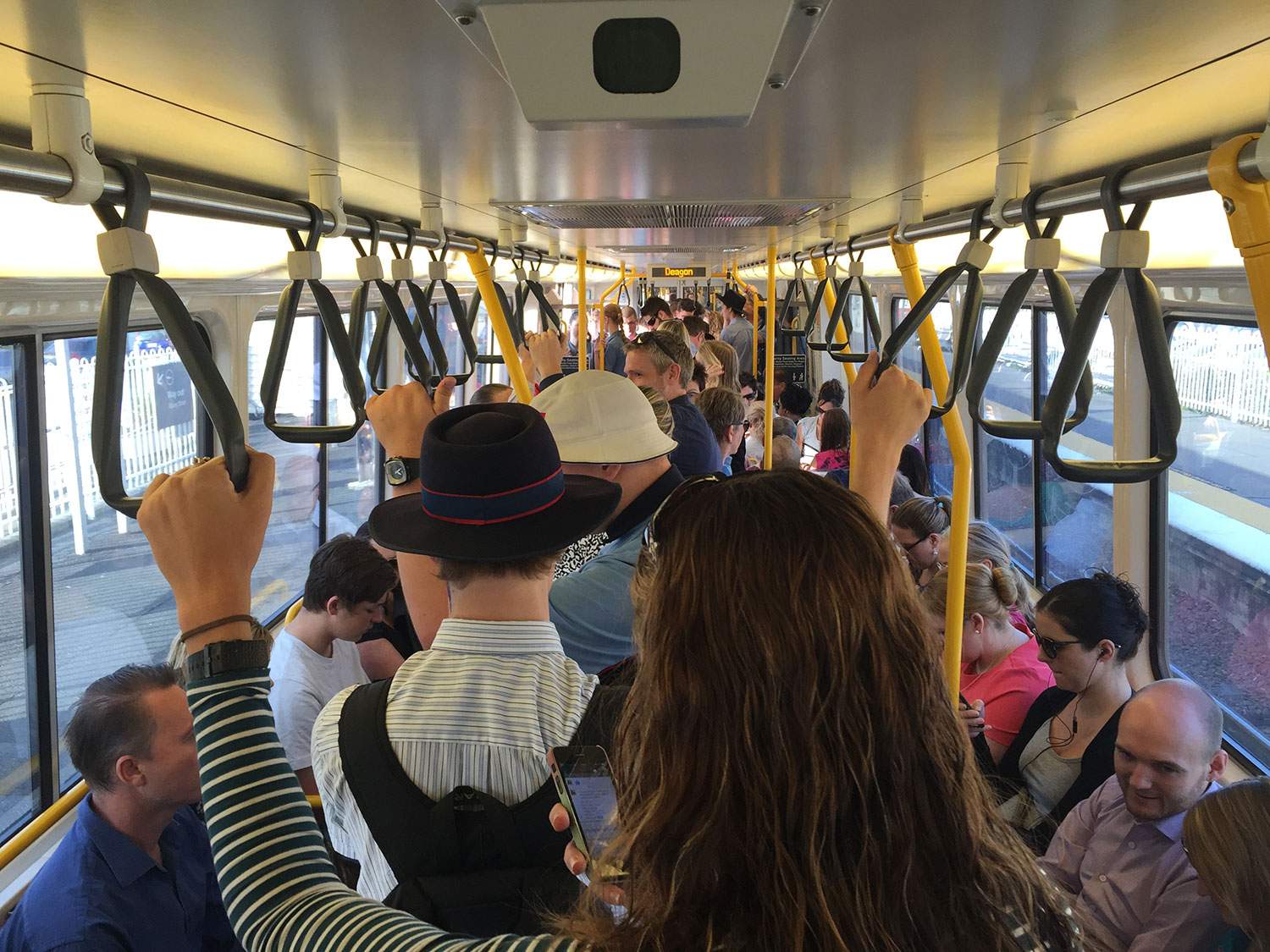 Commuters aboard a packed delayed train bound for Brisbane's CBD from Deagon station