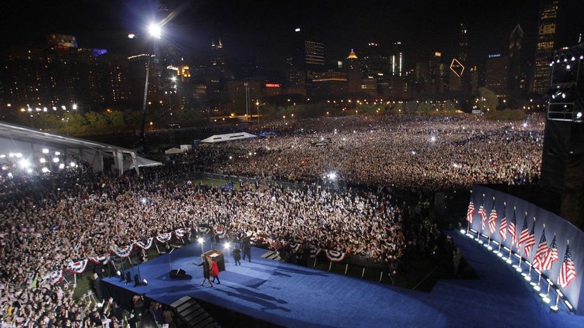 Barack Obama and his family arrive on stage to greet supporters at Grant Park