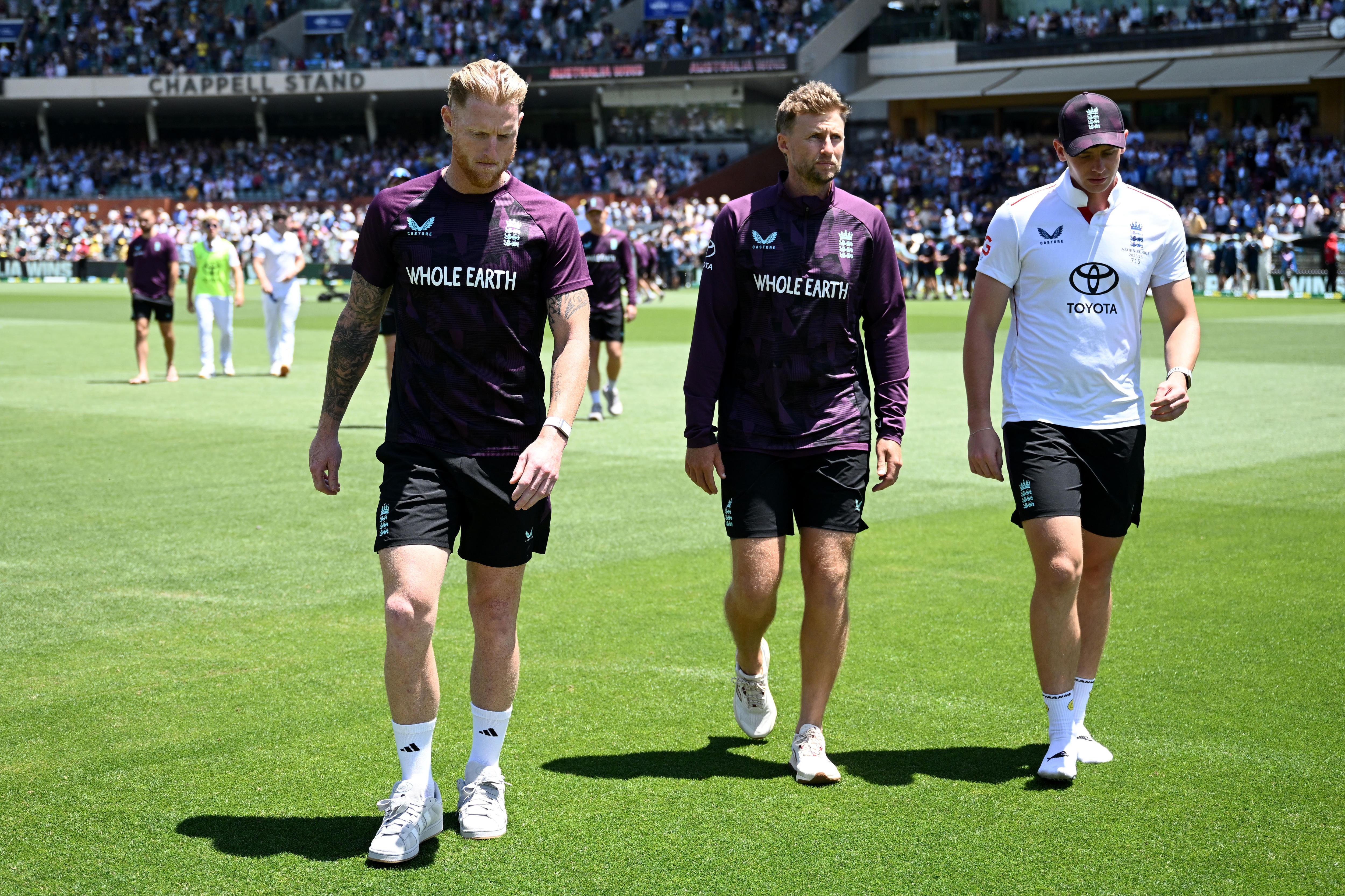 Ben Stokes, Joe Root and Jamie Smith walk together