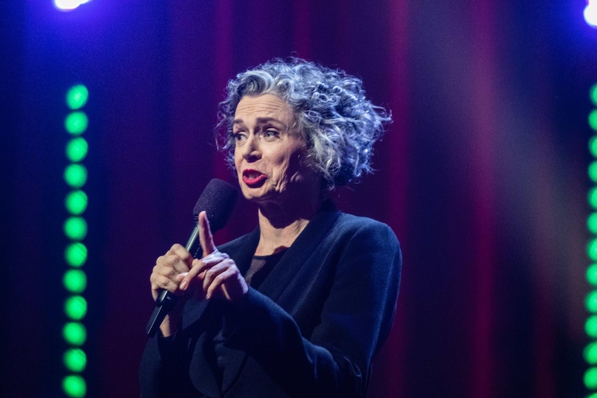 Comedian Judith Lucy performing stand up on stage at Just For Laughs. She may no longer perform stand up.