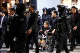 Indonesian Siti Aisyah is escorted as she revisits the Kuala Lumpur International Airport.