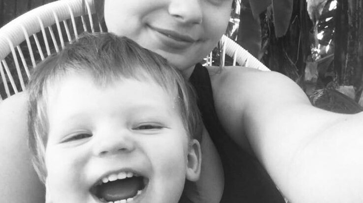 Two-year-old Ruben Scott smiling with his mother Natasha Scott.