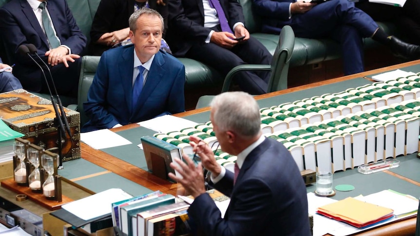 Bill Shorten listens to Malcolm Turnbull during Question Time
