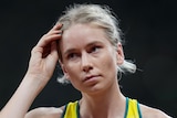 An Australian female high jumper composes herself at the Tokyo Olympics.
