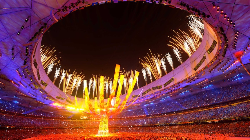Fireworks explode over the National Stadium during the Beijing Olympic Games closing ceremony.