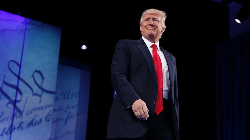 President Donald Trump walk onto the stage at the 2017 Conservative Political Action Conference in Maryland.