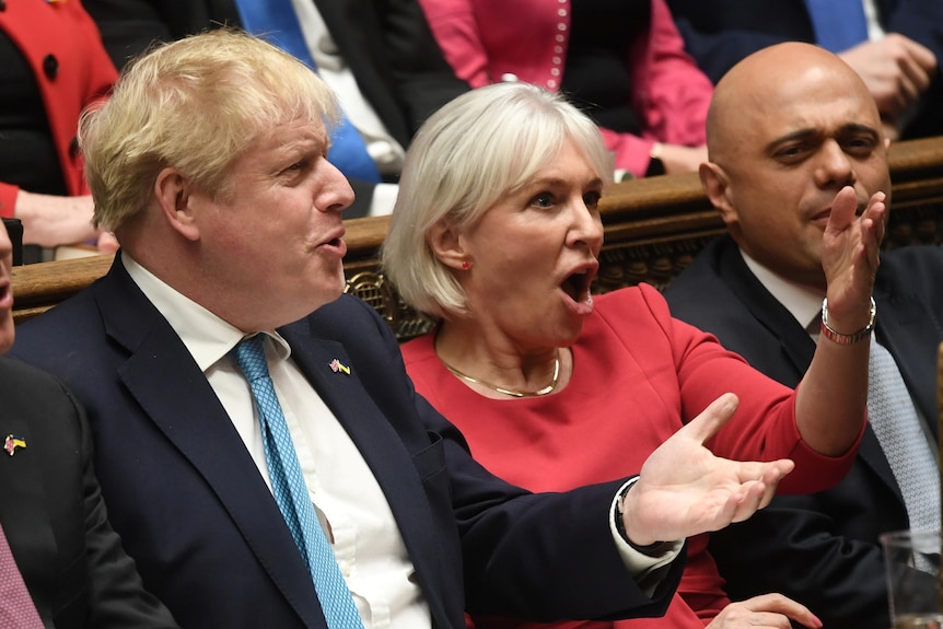 Boris Johnson and Nadine Dorries react during Prime Minister's Questions.