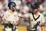 Rogers and Warner leave the field after day three