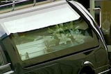The coffin of Elliott Fletcher in a hearse outside St Patrick's College.