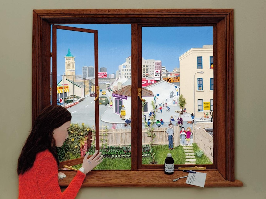 A girl looks out of her window onto her garden, in front of an urban street with one small tree.