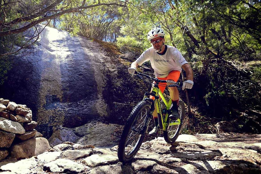 A cyclist takes on a Blue Derby mountain bike track