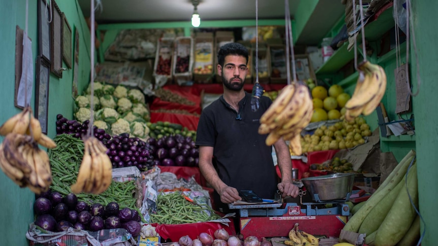 Man in a fruit shop in Leh