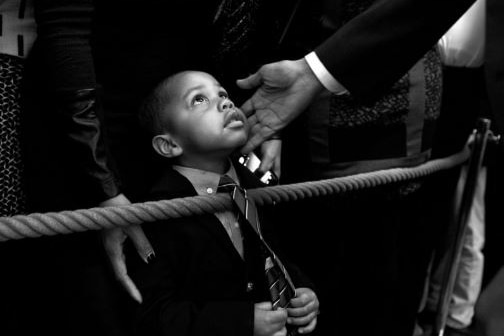 Youngster looks up while President Barack Obama spoke during a reception at the White House