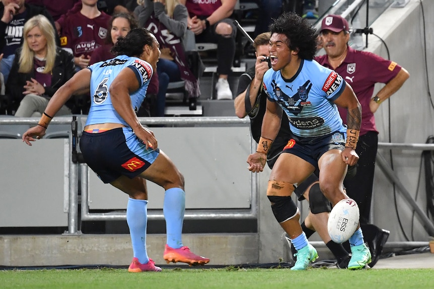 NSW Blues teammates Jarome Luai and Brian To'o shout as they celebrate To'o's try in State of Origin.