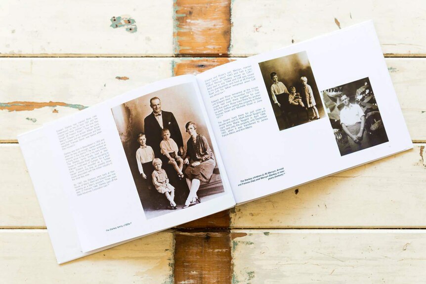 A book of family photos in black and white.