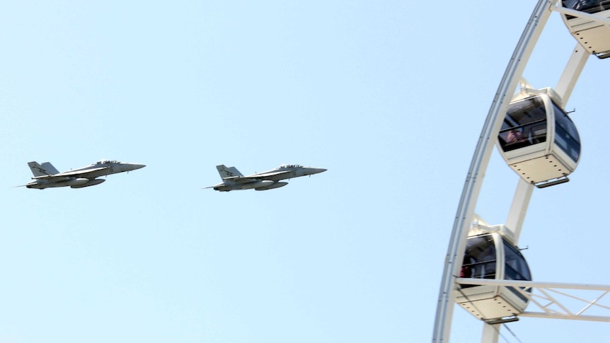 Two RAAF F/A-18F jets fly over Brisbane on a practice run ahead of Riverfire.