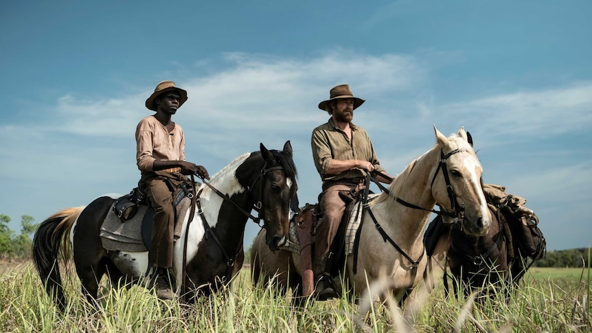 A still from the film High Ground of actors Jacob Junior Nayinggul and Simon Baker on horseback, 1930s Arnhem Land