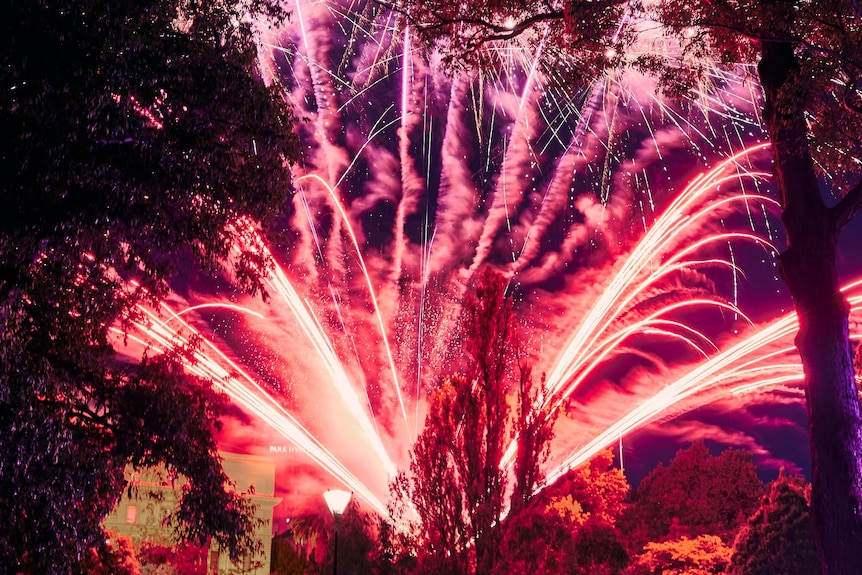 Pink fireworks lighting up the sky in Melbourne
