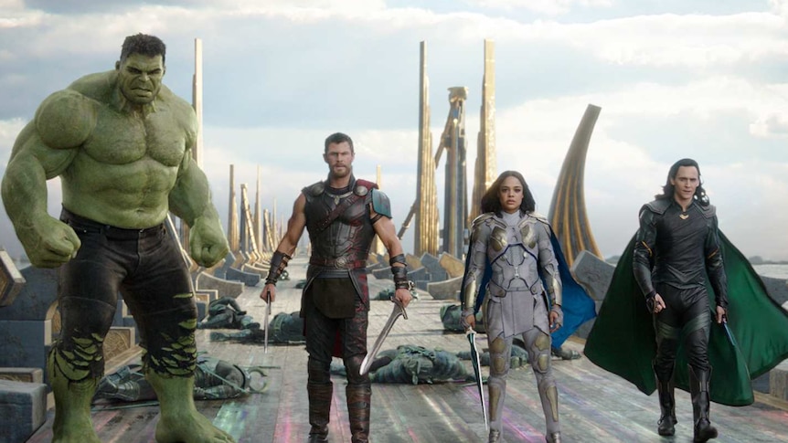 The Hulk, Thor, Valkyrie and Loki walk on a whrf