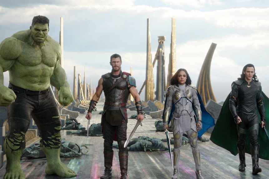 The Hulk, Thor, Valkyrie and Loki walk on a whrf