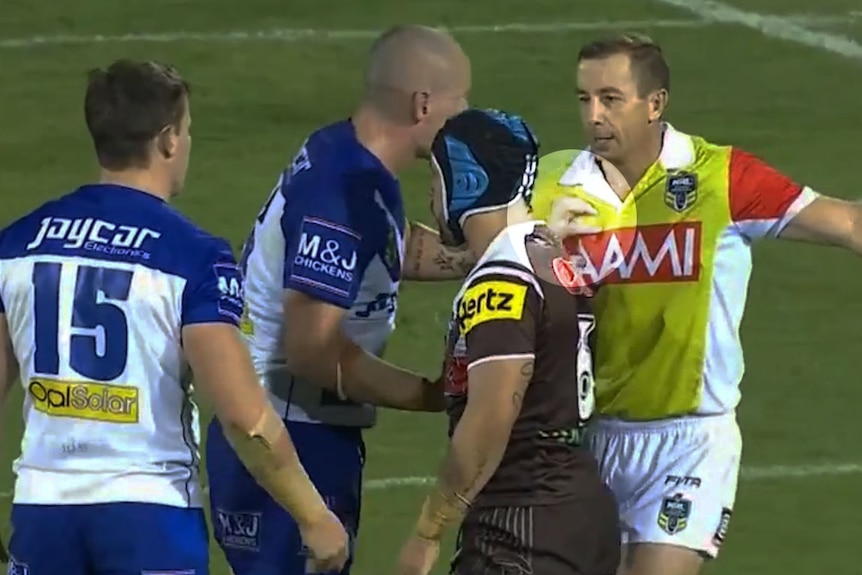 Free to play ... David Klemmer makes contact with referee Ben Cummins against the Panthers