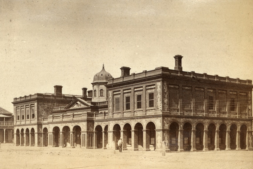 A sepia photograph of the Port Adelaide police station, court house and customs house in 1870.
