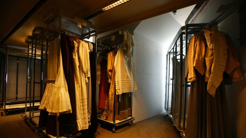 Clothes racks with dresses and costumes.