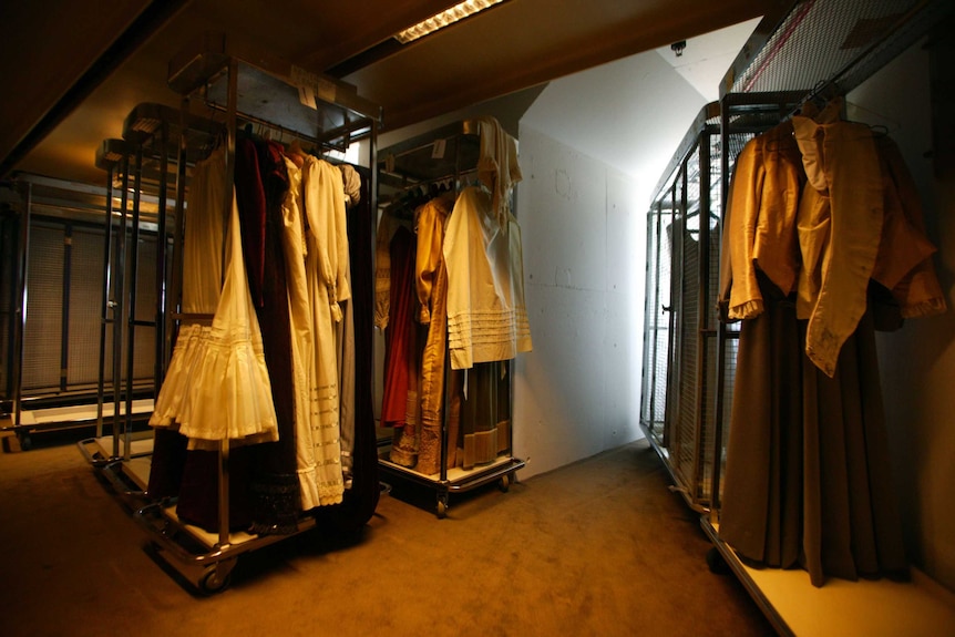 Clothes racks with dresses and costumes.