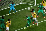 Colombia's James Rodriguez heads the opening goal against Ivory Coast at the World Cup.