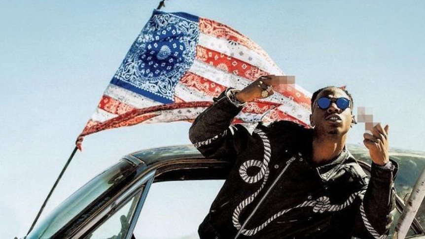 Image from Joey Badass' 2017 album All Amerikkkan Badass featuring Joey leaning out a car giving the finger