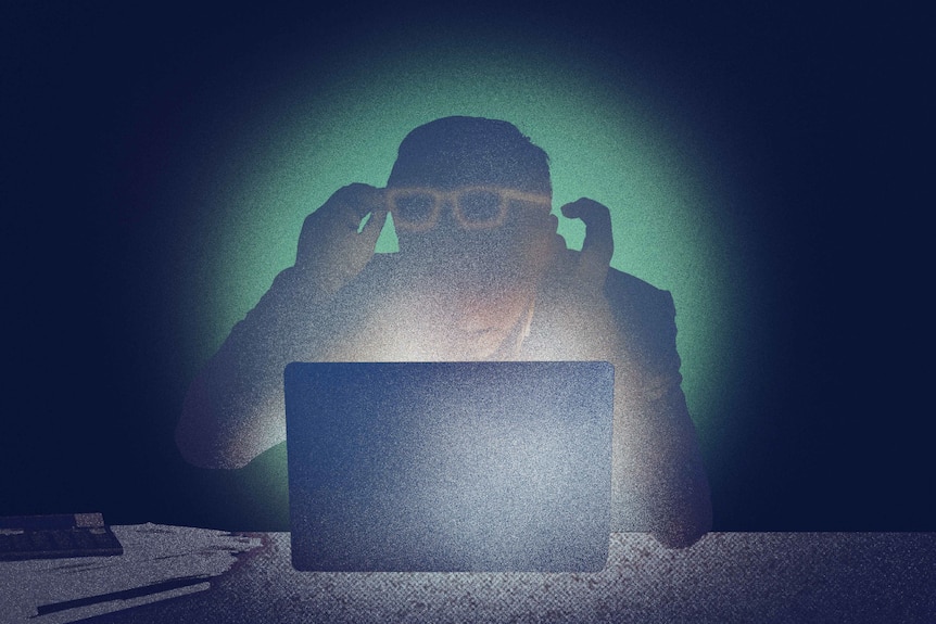 An illustration of a shocked man with both hands and glasses raised sitting at desk in front of a laptop in a dark room.