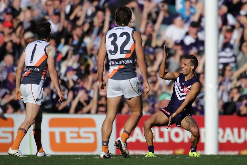 Danyle Pearce celebrates a goal for Fremantle