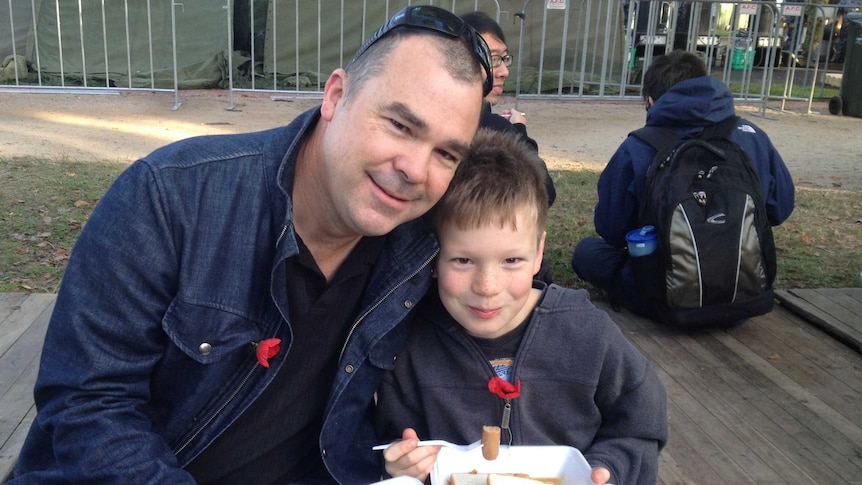 Father and son share breakfast after the dawn service in Melbourne