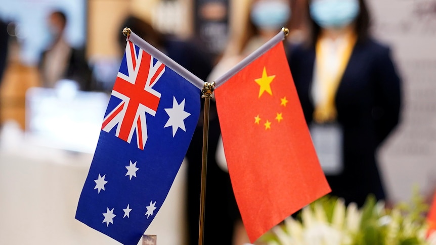 Chinese and Australian flags at an event in Shanghai