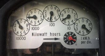 A meter shows energy output using five dials measuring kilowatt hours.