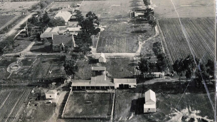 A historic black and white photo of the Tally Ho Boys Training Farm.